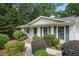Inviting front entrance with neat landscaping and a well-maintained walkway to the home's entry at 2384 Shadowood Sw Dr, Conyers, GA 30094