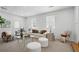 Comfortable living room with neutral tones, a large window, and modern decor at 2384 Shadowood Sw Dr, Conyers, GA 30094