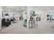Open-concept living room with fireplace, stylish decor, and ample natural light at 2384 Shadowood Sw Dr, Conyers, GA 30094