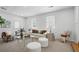 Relaxing living room featuring large windows and stylish decor at 2384 Shadowood Sw Dr, Conyers, GA 30094
