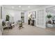 Cozy sitting room featuring neutral walls, modern furniture, and lots of natural light at 2384 Shadowood Sw Dr, Conyers, GA 30094