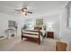 Serene main bedroom featuring a ceiling fan, neutral walls, and lots of natural light at 2384 Shadowood Sw Dr, Conyers, GA 30094