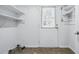 Mud room with utility storage, shelving and exterior access to outside at 2384 Shadowood Sw Dr, Conyers, GA 30094
