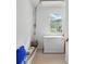 This utility room offers extra storage and a large freezer at 2384 Shadowood Sw Dr, Conyers, GA 30094