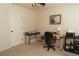 Bedroom with a dedicated desk and chair, ceiling fan, and neutral carpet at 258 Creek View Ln, Acworth, GA 30102