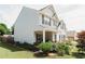 Two-story home with manicured landscaping, inviting porch, and neutral siding at 258 Creek View Ln, Acworth, GA 30102