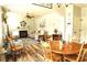 Open-concept living room with a fireplace, comfortable seating, and hardwood floors at 258 Creek View Ln, Acworth, GA 30102
