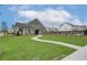 View of the well-maintained community clubhouse, featuring landscaped grounds and inviting entrance at 2700 Westgate Park Dr, Loganville, GA 30052