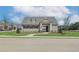 Community clubhouse is surrounded by lush green lawns, enhancing the curb appeal at 2700 Westgate Park Dr, Loganville, GA 30052