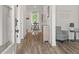 Inviting entryway with hardwood floors, leading to a dining area at 2700 Westgate Park Dr, Loganville, GA 30052