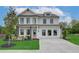 Beautiful two-story home with a manicured lawn, elegant landscaping, and a spacious driveway at 2700 Westgate Park Dr, Loganville, GA 30052