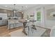 Modern kitchen with stainless steel appliances, kitchen island and barstool seating at 2700 Westgate Park Dr, Loganville, GA 30052