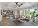 Open concept living room with view of the kitchen and outdoor light at 2700 Westgate Park Dr, Loganville, GA 30052