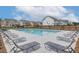 Community pool with ample lounge chairs provides a relaxing outdoor space for residents and guests at 2700 Westgate Park Dr, Loganville, GA 30052