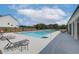 Community pool with lounge chairs offers a refreshing outdoor space for relaxing and socializing at 2700 Westgate Park Dr, Loganville, GA 30052