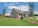 Exterior view of pool house with a well-manicured lawn enhances community's curb appeal at 2700 Westgate Park Dr, Loganville, GA 30052