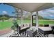 Comfortable screened porch with stylish seating, perfect for unwinding and enjoying the outdoor scenery at 2700 Westgate Park Dr, Loganville, GA 30052