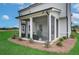 Inviting screened porch with an outdoor lounge area, providing a comfortable and bug-free retreat at 2700 Westgate Park Dr, Loganville, GA 30052