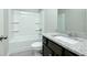 Bathroom features a shower-tub combination and granite vanity at 3018 Old Covington Rd, Covington, GA 30014