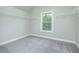Walk in closet with plenty of shelving and a single window at 3018 Old Covington Rd, Covington, GA 30014