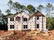 Exterior shot of a new two-story home under construction showing the shape and layout at 3018 Old Covington Rd, Covington, GA 30014