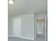 Neutral hallway with carpet and white trim, providing access to other rooms at 3018 Old Covington Rd, Covington, GA 30014