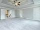 Spacious main bedroom includes neutral carpeting, and tray ceiling at 3018 Old Covington Rd, Covington, GA 30014