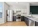 A well-appointed kitchen with stainless steel appliances, sleek countertops, and modern cabinetry at 103 Timber Ridge Dr, Cartersville, GA 30121
