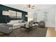 Stylish living room with a dark accent wall, contemporary furnishings, and modern decor at 103 Timber Ridge Dr, Cartersville, GA 30121