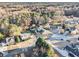A serene aerial view of homes nestled amongst lush trees in a peaceful residential neighborhood at 128 Graybrook Ct, Grayson, GA 30017