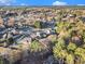 An elevated view of residential homes amidst a mature landscape, highlighting the area's charm at 128 Graybrook Ct, Grayson, GA 30017