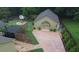 Aerial view of the yard, including an outdoor fire pit and detached structure at 128 Graybrook Ct, Grayson, GA 30017