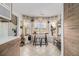 Bright breakfast nook with a table and barstools in front of a window bay and modern cabinets at 128 Graybrook Ct, Grayson, GA 30017