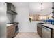 Bright kitchen featuring stainless steel appliances, wooden cabinets, and white backsplash at 128 Graybrook Ct, Grayson, GA 30017