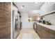 Modern kitchen featuring stainless steel appliances, wood cabinets, and tile flooring at 128 Graybrook Ct, Grayson, GA 30017