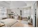 Bright main bedroom featuring hardwood floors, tray ceiling, lots of natural light, and a sitting area at 128 Graybrook Ct, Grayson, GA 30017