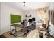 Functional home office space with neutral colors, natural lighting, and computer setup at 128 Graybrook Ct, Grayson, GA 30017