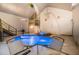 Indoor pool area boasting a waterfall feature and upstairs recreation area at 128 Graybrook Ct, Grayson, GA 30017