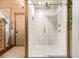 This bright, modern frameless shower features white tile and upscale fixtures, with a spa-like atmosphere at 128 Graybrook Ct, Grayson, GA 30017