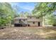 View of backyard featuring a wooden deck and the rear exterior of the home at 155 S South Meadowcliff Cir, Carrollton, GA 30116