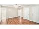 Spacious bedroom with hardwood floors, ceiling fan and walk-in closet at 155 S South Meadowcliff Cir, Carrollton, GA 30116