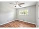 Bedroom with wood-look flooring, neutral walls, ceiling fan, and a window providing natural light at 155 S South Meadowcliff Cir, Carrollton, GA 30116