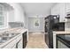 Bright kitchen with stainless steel sink, dishwasher, and ample countertop space at 155 S South Meadowcliff Cir, Carrollton, GA 30116