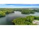 An aerial view of a beautiful lake surrounded by lush greenery, featuring a neighborhood nearby at 178 Sunshower Rdg, Canton, GA 30114