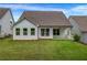A well maintained backyard with lush green grass and a view of the home's rear windows at 178 Sunshower Rdg, Canton, GA 30114