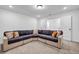 Finished basement featuring a large sectional sofa and neutral carpet, perfect for relaxing at 178 Sunshower Rdg, Canton, GA 30114