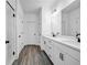 Bright bathroom showcasing a double vanity, sleek black fixtures, and a glass-enclosed shower at 178 Sunshower Rdg, Canton, GA 30114