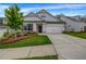 Inviting home with gray siding, a well-kept lawn, and a two-car garage at 178 Sunshower Rdg, Canton, GA 30114