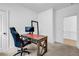 Bright office space with a dark wood desk, ergonomic chair, and ample lighting at 178 Sunshower Rdg, Canton, GA 30114