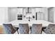 Bright kitchen boasts a large center island with seating, modern appliances, and white cabinetry at 178 Sunshower Rdg, Canton, GA 30114